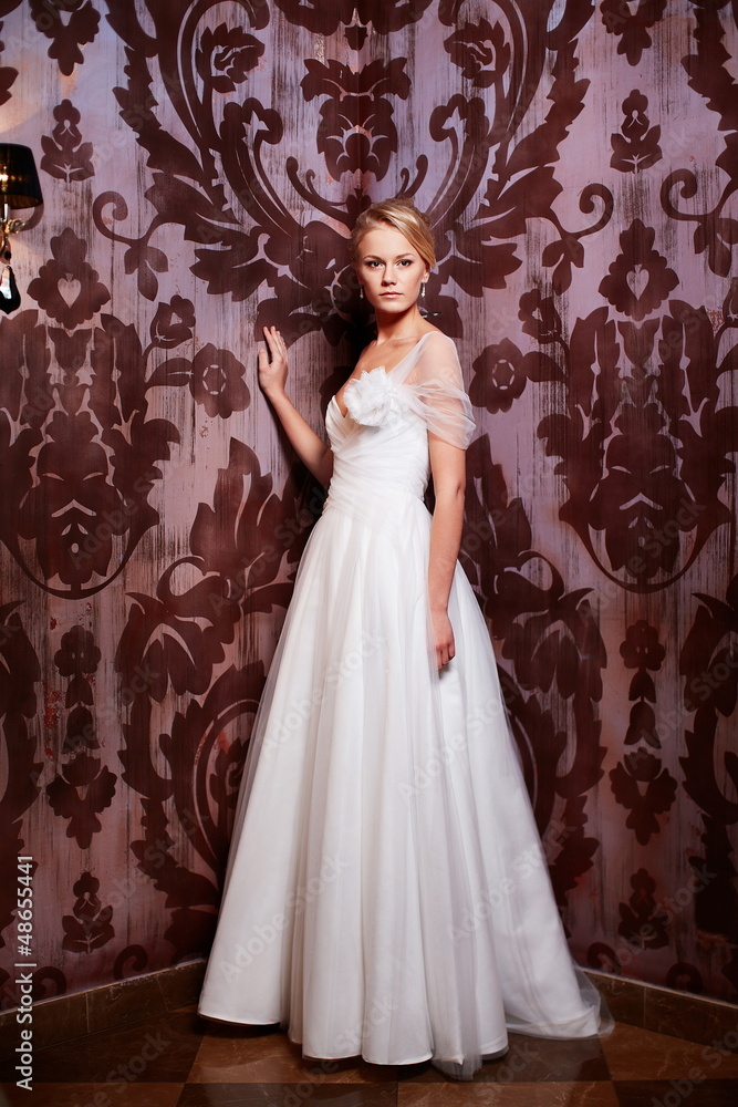 sexy blond bride in white wedding dress in interior sexy blond bride in white wedding dress in interior