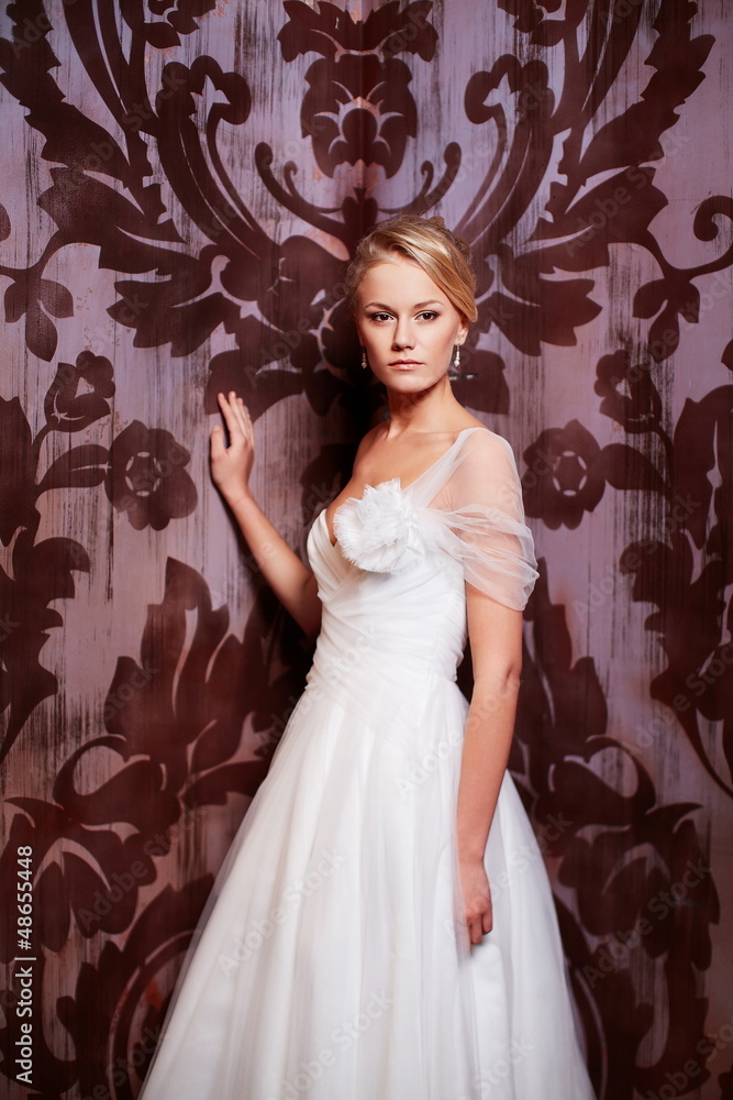 sexy blond bride in white wedding dress in interior sexy blond bride in white wedding dress in interior