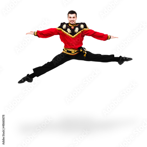 young dancer man wearing a folk russian costume jumping © StepStock