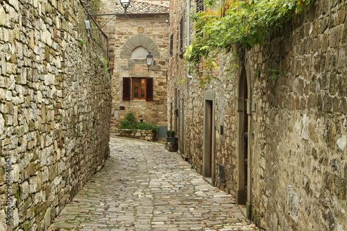 narrow  paved small street  in italian village Montefioralle