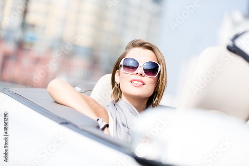 Close up of smiley woman in the cabriolet 