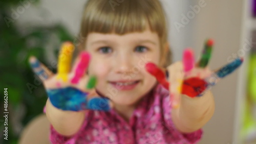 Funny girl coloring. Baby covered in paint