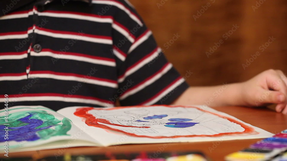 child draws paints 6