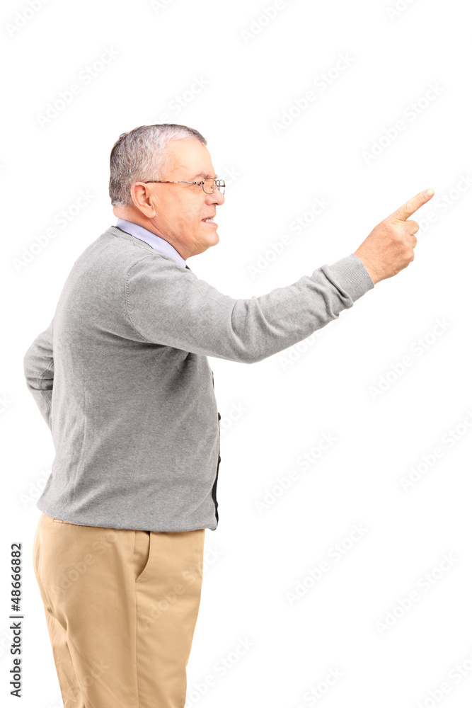 An angry mature man pointing with finger and threatening An angry mature man pointing with finger and threatening