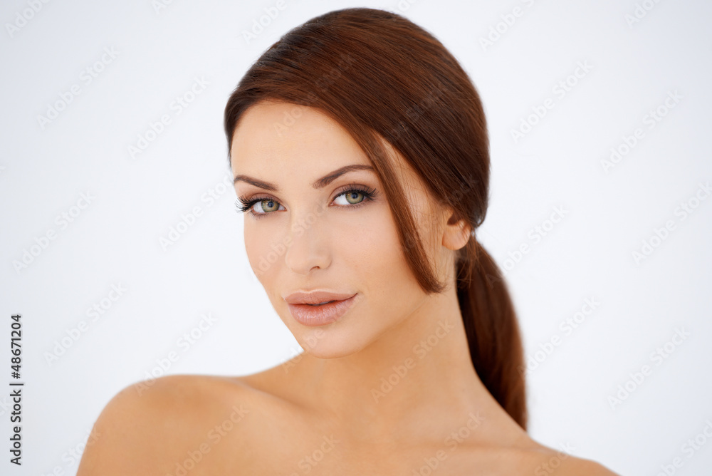 Sensual brown haired woman with bare shoulders Sensual brown haired woman with bare shoulders