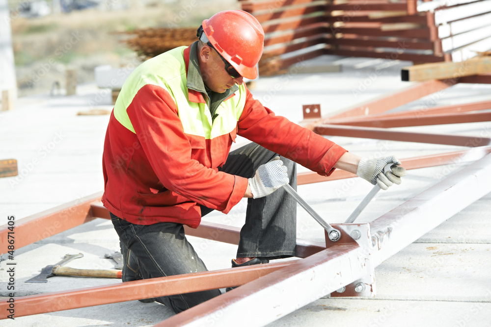 builder worker assembling metal construction builder worker assembling metal construction