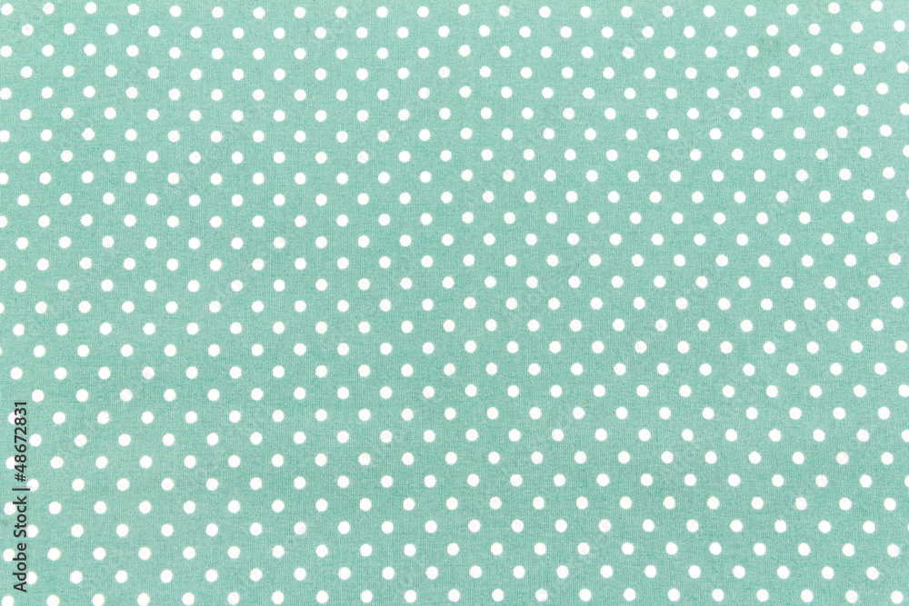 white dots on green