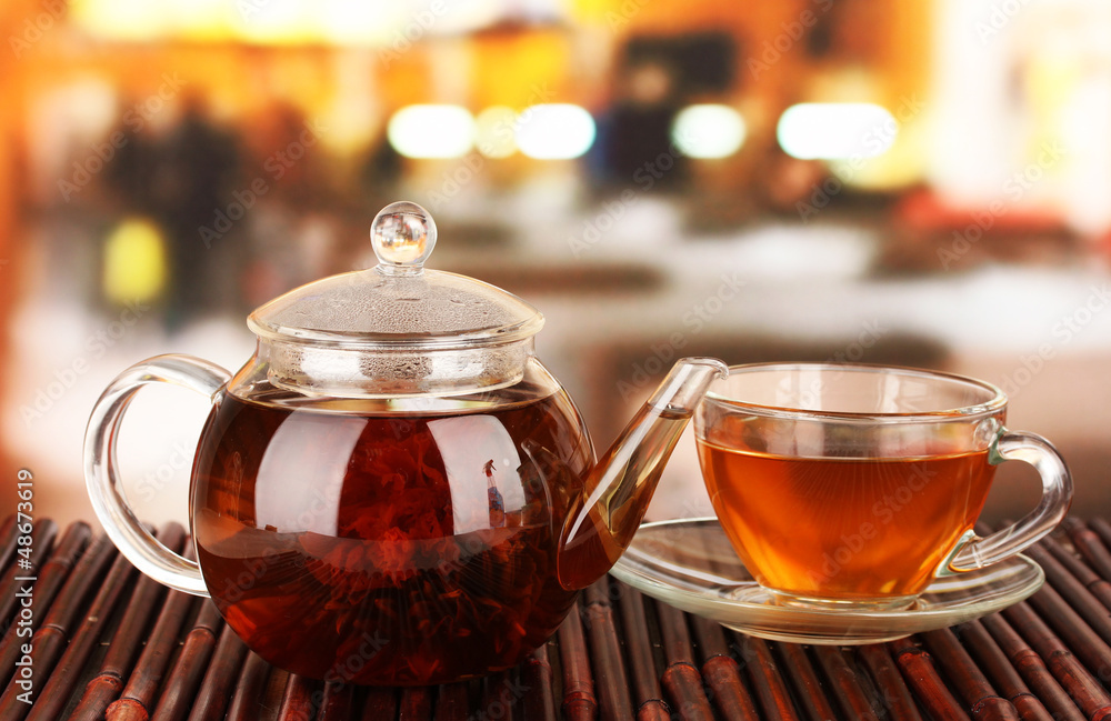 Exotic green tea with flowers in glass teapot Exotic green tea with flowers in glass teapot