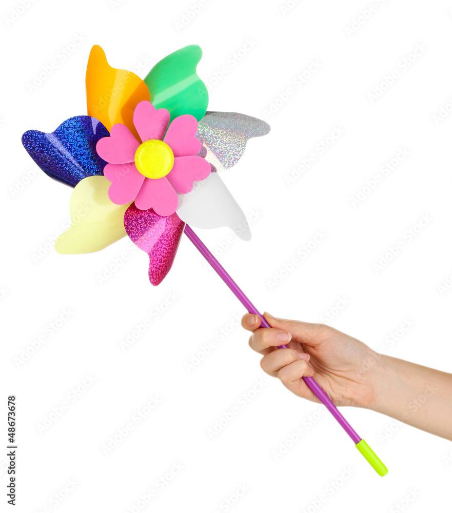 Colored pinwheel in hand isolated on white Colored pinwheel in hand isolated on white