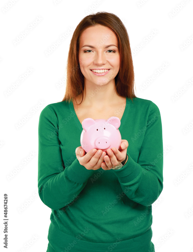 Young beautiful woman standing with piggy bank Young beautiful woman standing with piggy bank