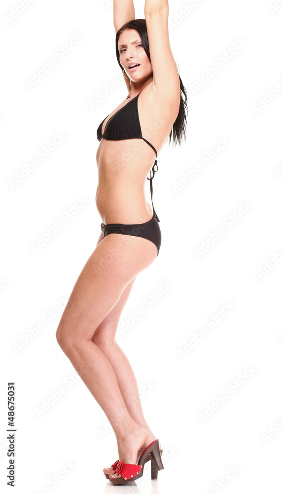 Fototapeta premium Portrait of sexy brunette in brown bikini isolated