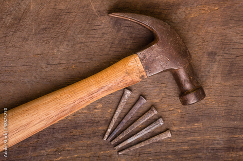 Hammer and nails on a wood board