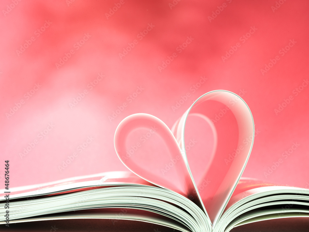 pages of a book curved into a heart shape pages of a book curved into a heart shape