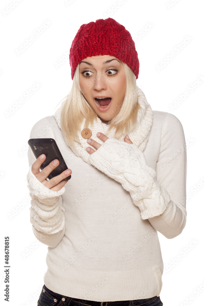 pleasantly surprised girl with red hat reading a text message pleasantly surprised girl with red hat reading a text message