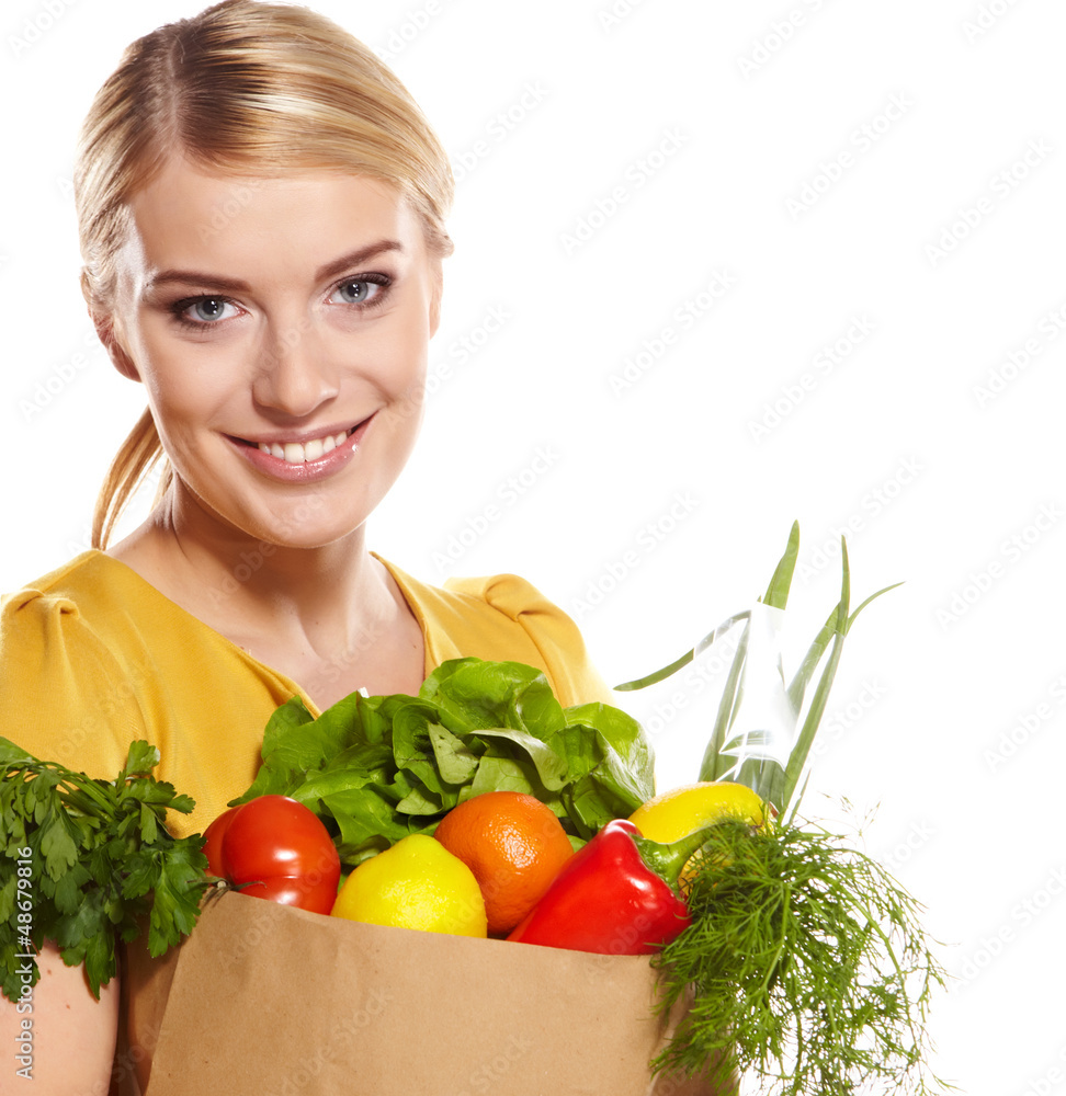 woman holding a shopping bag full of groceries, mango, salad, r woman holding a shopping bag full of groceries, mango, salad, r