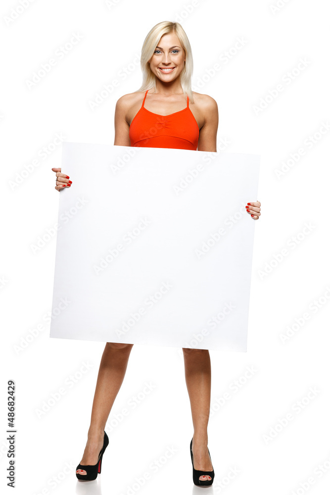 Smiling woman in full length holding empty banner Smiling woman in full length holding empty banner