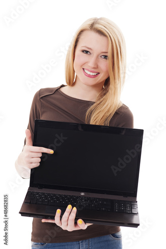 Young blonde woman pointing at her laptop