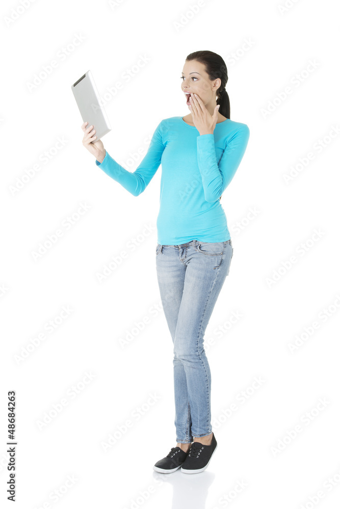 Young pretty woman working on tablet computer Young pretty woman working on tablet computer