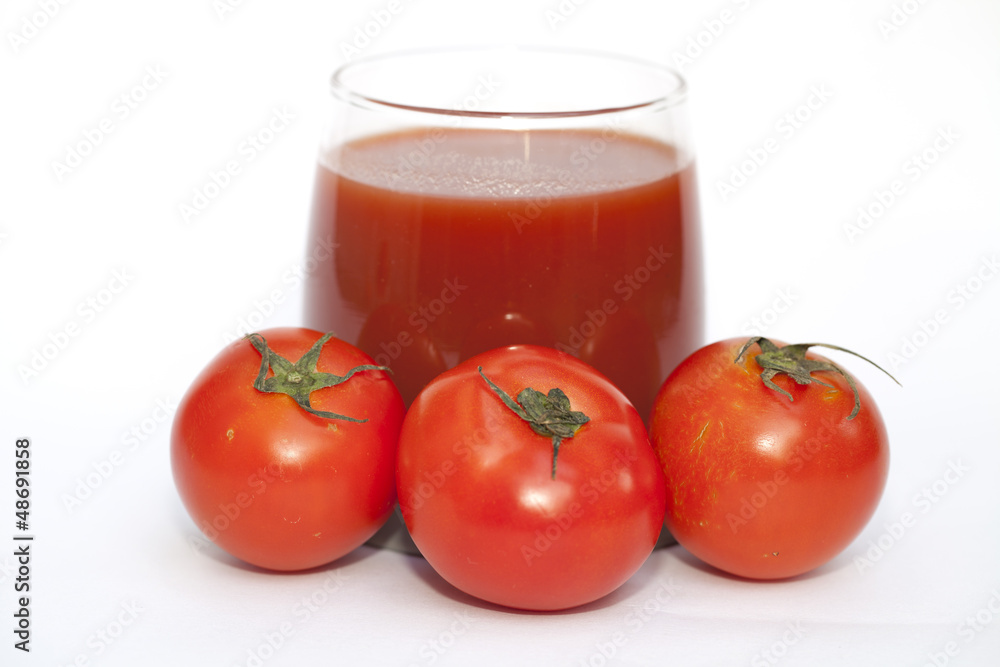 Tomato and juice on the white background Tomato and juice on the white background