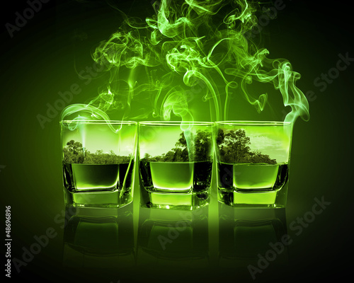 Three glasses of green absinth