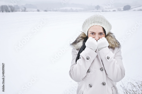 woman feeling cold in the snow