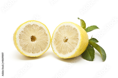 Half Japanese lemon isolated on white background
