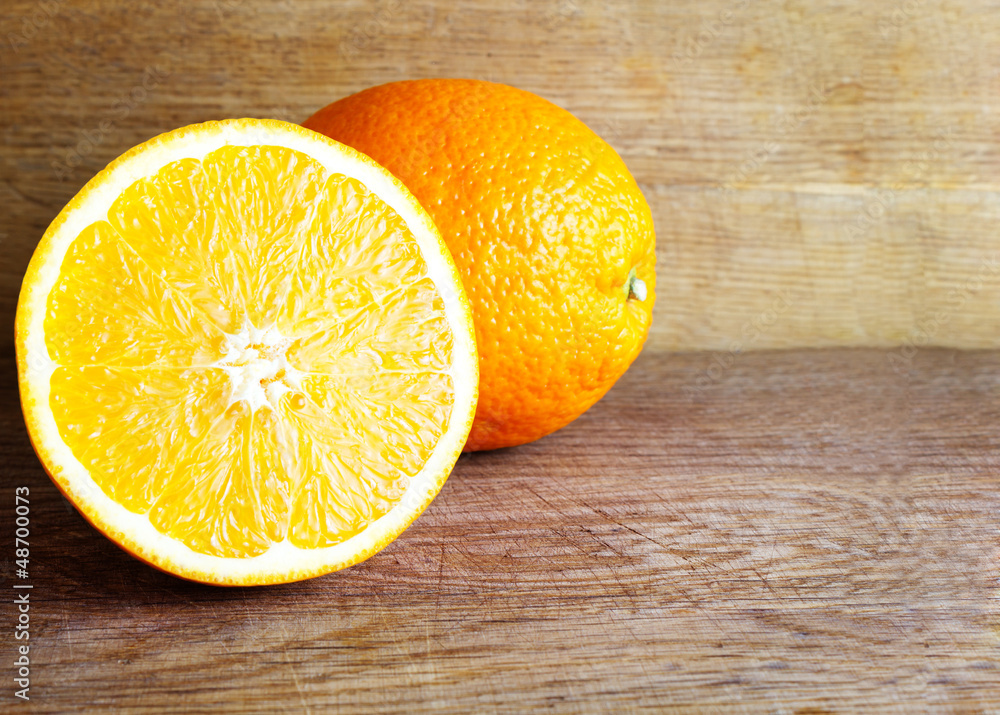 Fresh oranges on wooden background Fresh oranges on wooden background