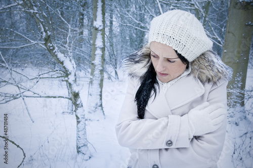 Принти на полотні woman alone and cold in forest covered by snow