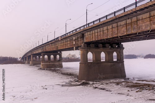 Bridge across the frozen river in Omsk. Siberia.
