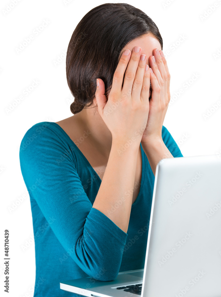 Young tired woman face palm working on laptop Young tired woman face palm working on laptop
