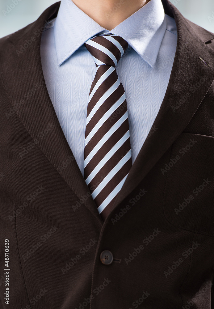 Closeup of torso of confident business man wearing elegant suit Closeup of torso of confident business man wearing elegant suit