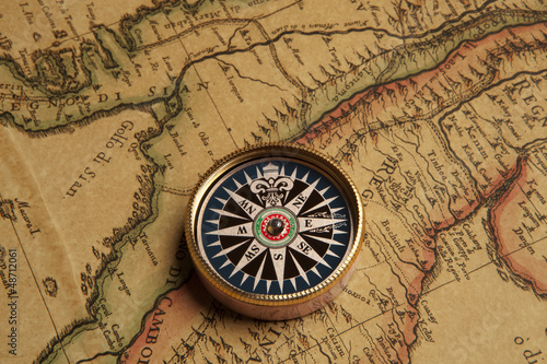 Vintage compass and old map