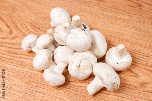 Champignons mushrooms on wood texture