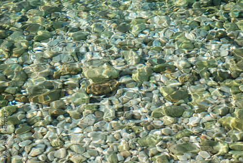 Sea floor with pebbles underwater © grondetphoto