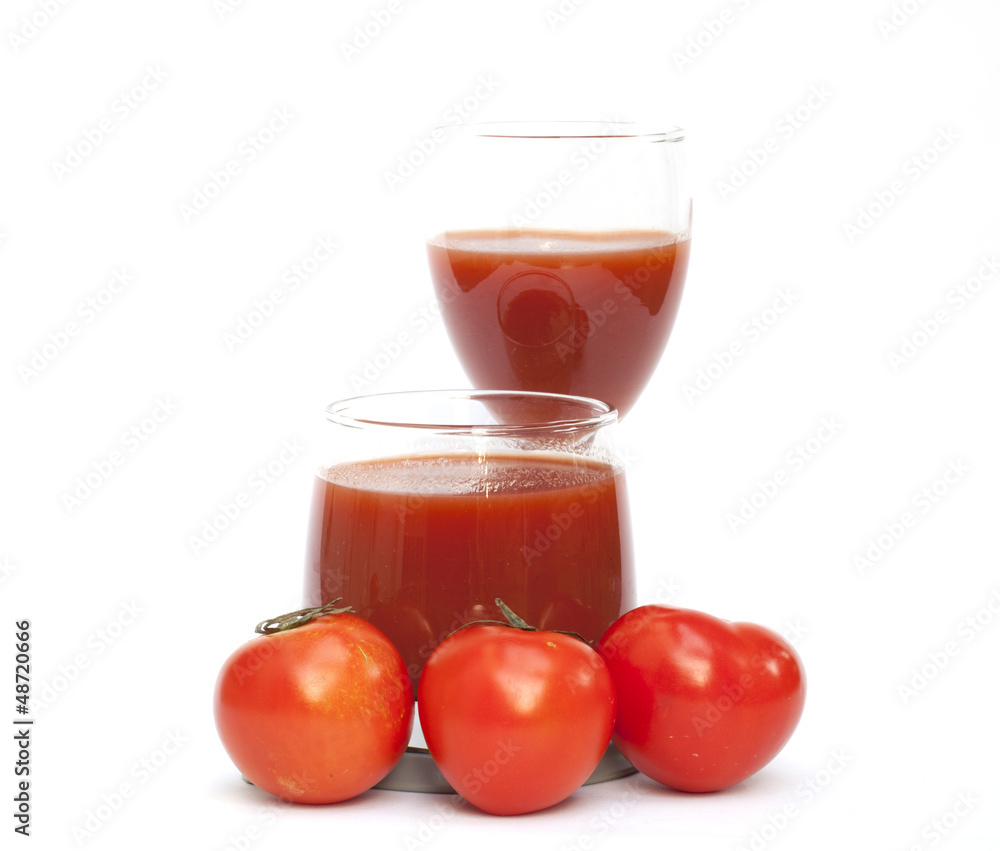 Tomato and juice on the white background Tomato and juice on the white background