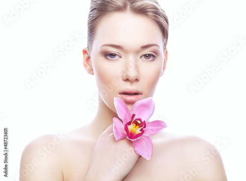 cute woman with clean skin and flower