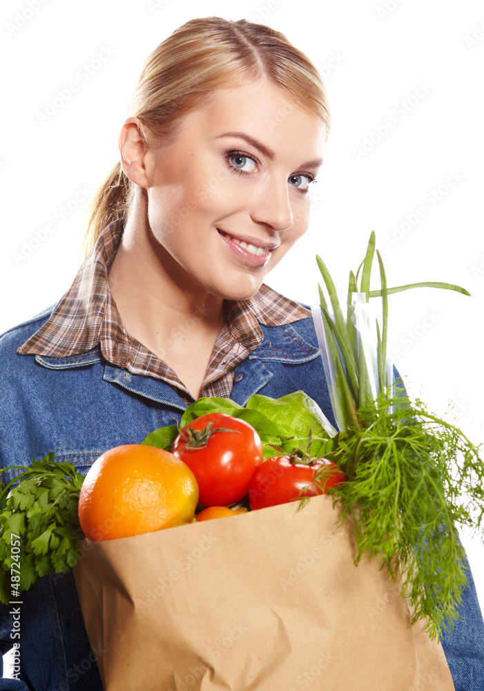 Young woman with a grocery shopping bag. Isolated on white backg Young woman with a grocery shopping bag. Isolated on white backg