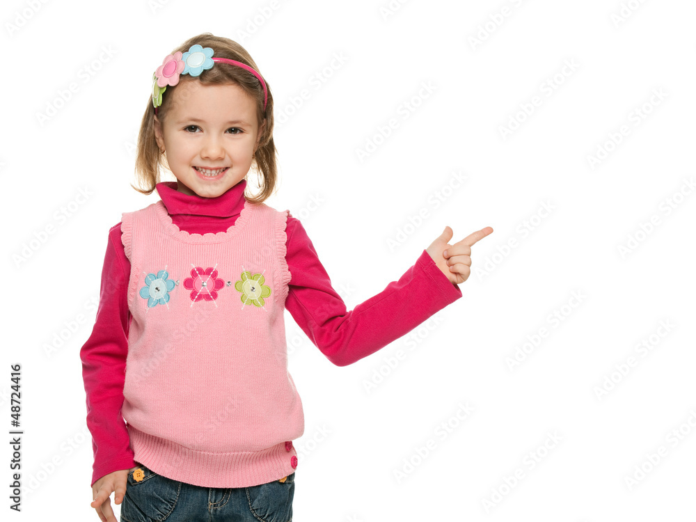 Cheerful little girl points finger at something Cheerful little girl points finger at something