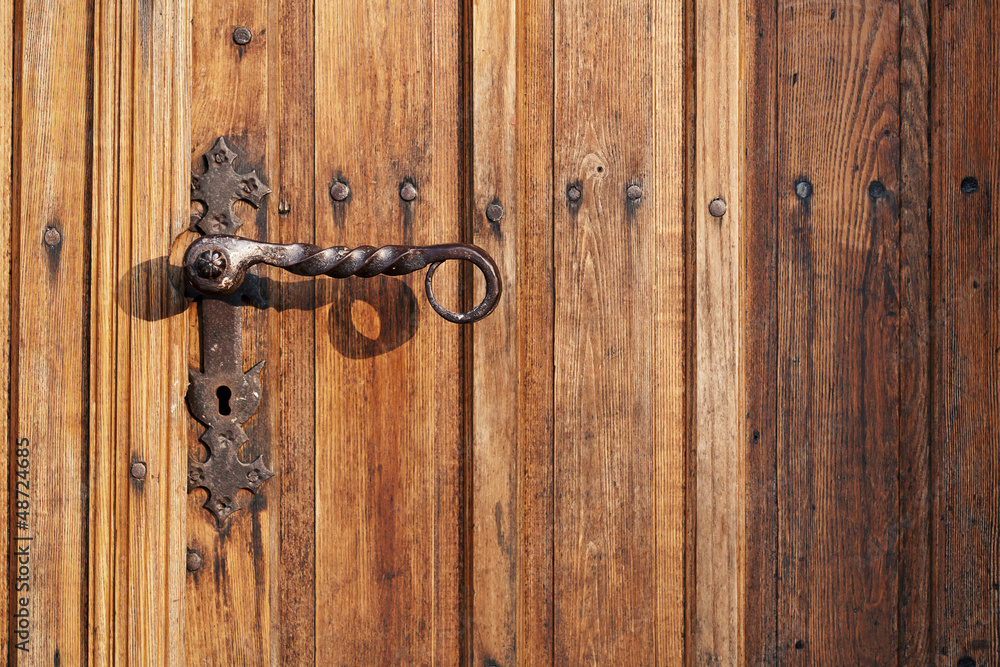 Ancient door handle on old door Ancient door handle on old door