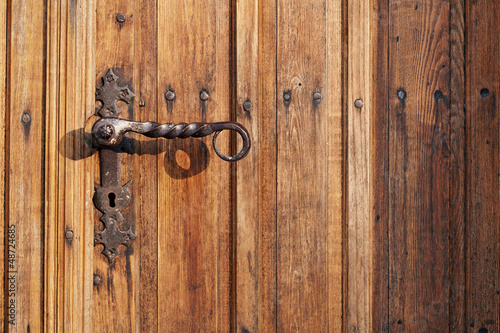 Ancient door handle on old door