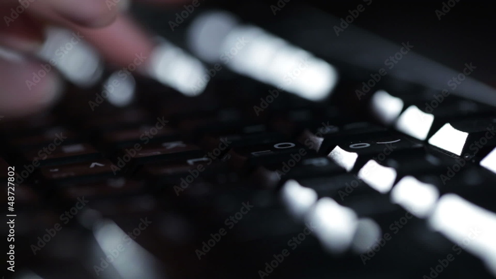 Typing on the keyboard at night. Typing on the keyboard at night.