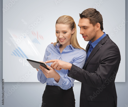 man and woman with tablet pc