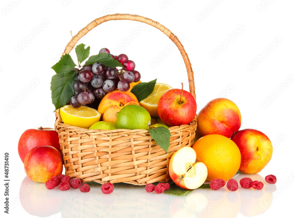 Assortment of exotic fruits in basket, isolated on white