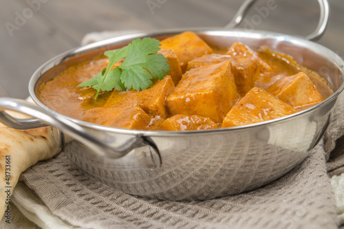 Paneer Butter Masala - Indian curd cheese curry in a balti dish.