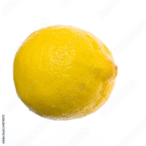 yellow ripe lemon over the white background