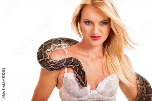 sexy blonde woman posing with python in studio