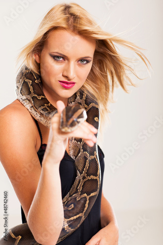 sexy young blonde woman with python