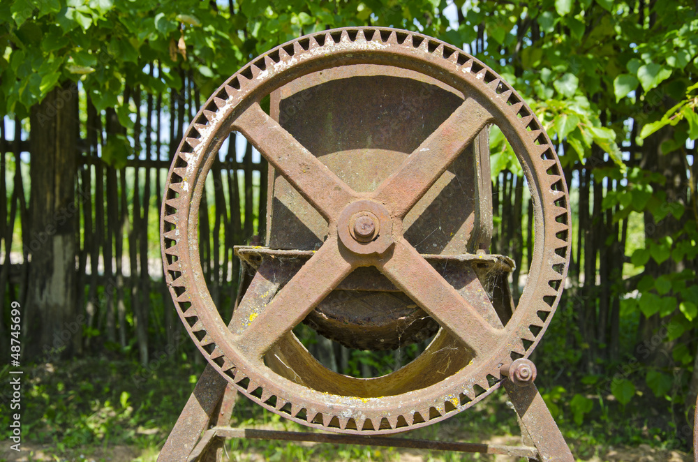 old agriculture metal wheel in garden old agriculture metal wheel in garden