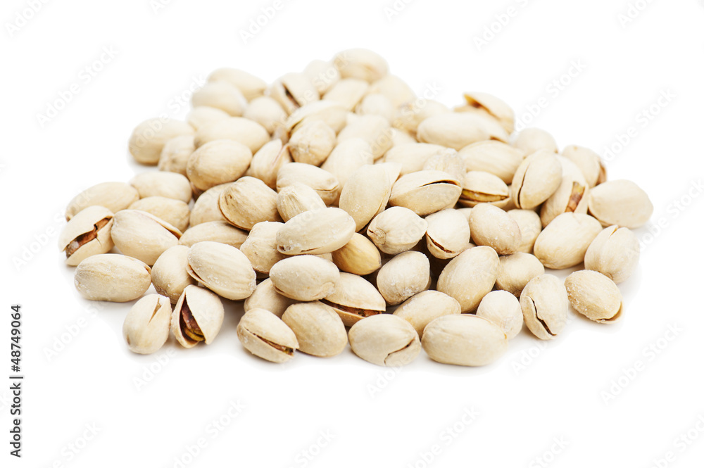 dry salted pistachios on white background