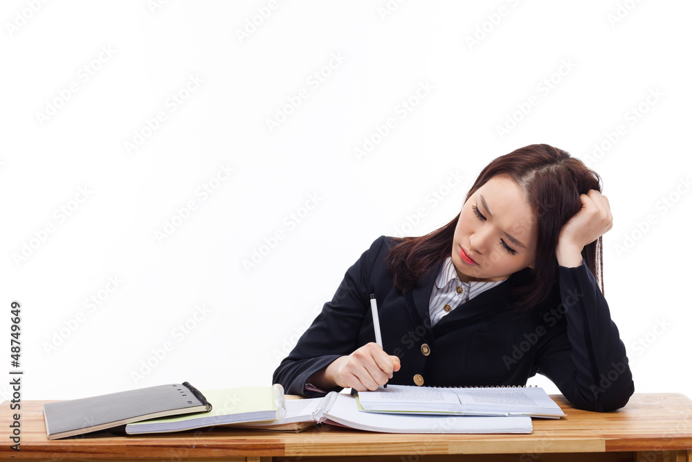 Young Asian student having trouble on desk. Young Asian student having trouble on desk.